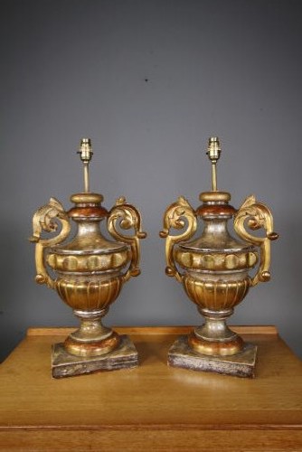 A pair of 19th-century carved pine urn table lamps with distressed gold leaf finish, scrolled handles, and square plinth bases. View III