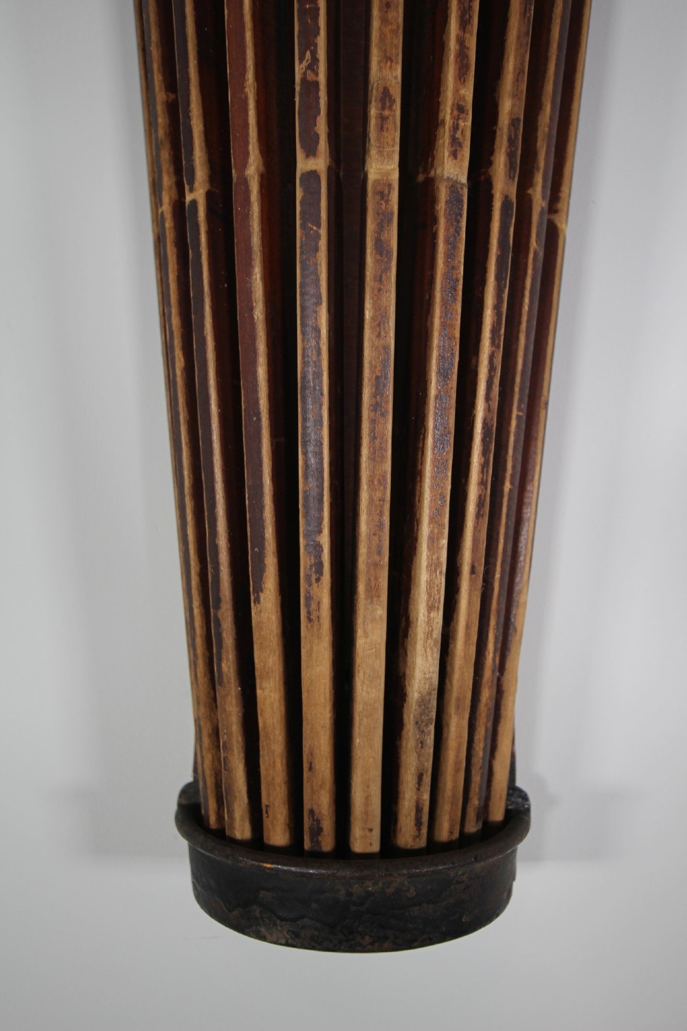 An antique wall-mounted wooden clothes dryer featuring multiple moveable laths fanning out from a central dark wood backplate. View IV