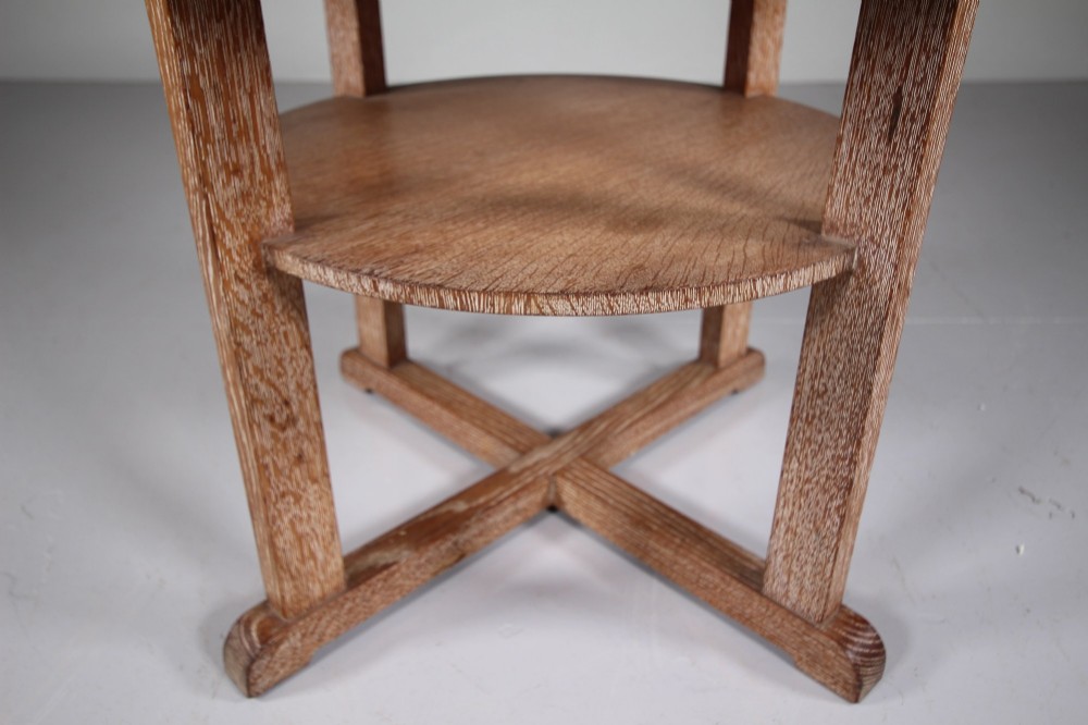 A circular oak two-tier side table featuring straight square legs and an X-frame base stretcher. View IV