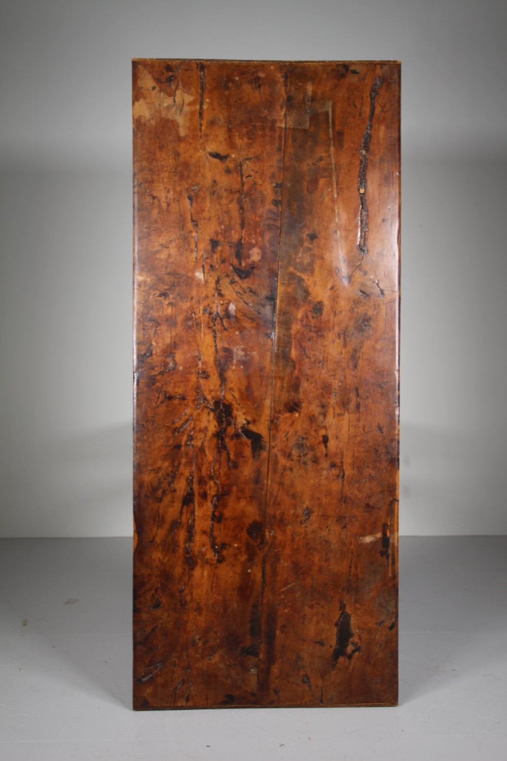 An 18th-century rustic fruitwood dining table featuring a solid plank top and straight square legs joined by a low stretcher base. View IV