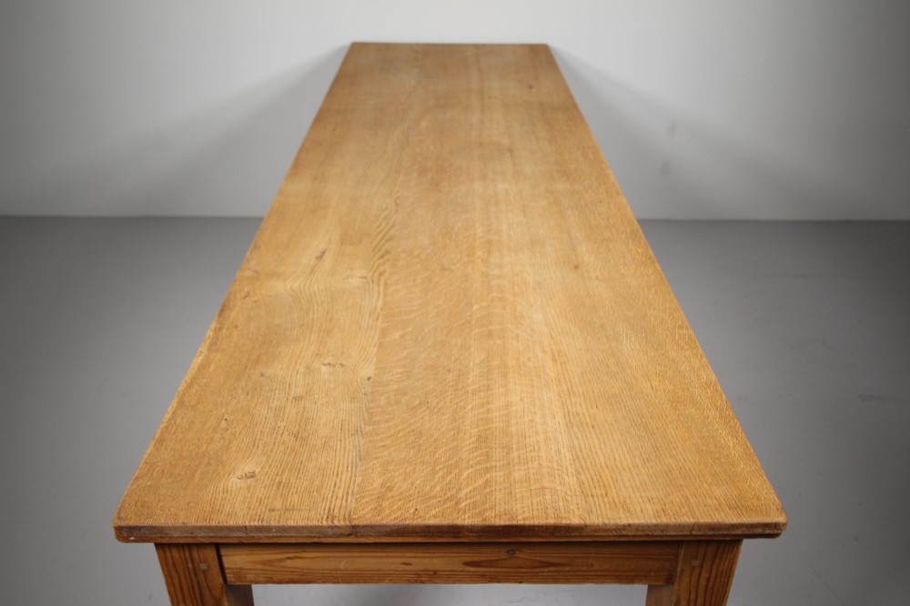 A large 19th-century English pine dining table featuring a solid plank top and four simple square legs. View IV