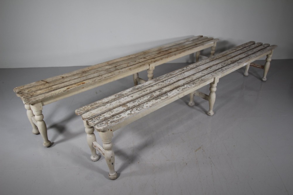 A pair of long 19th-century painted pine greenhouse benches featuring slatted tops and turned legs with lower stretchers. View III