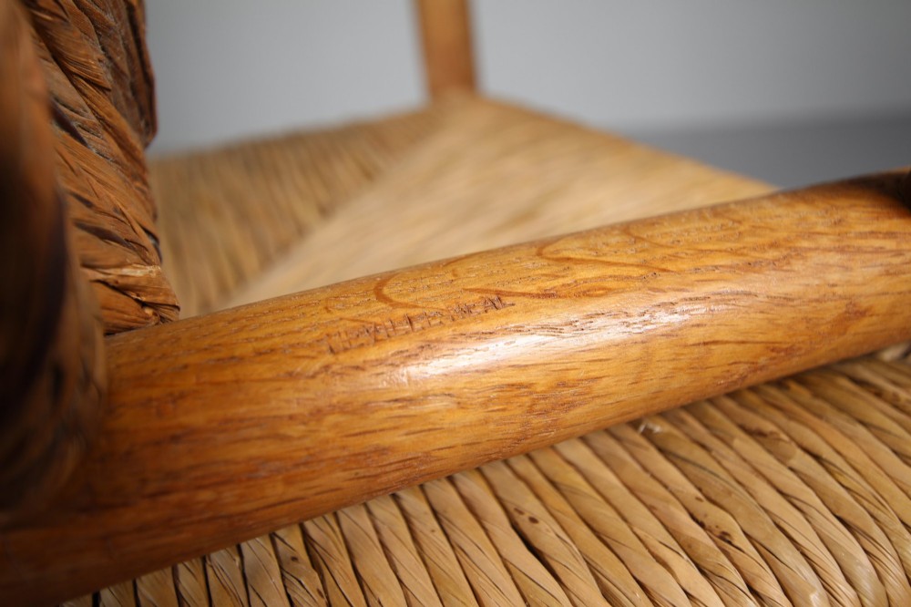 A pair of Arts and Crafts oak ladderback side chairs featuring hand-woven rush seats and four shaped back slats. View III
