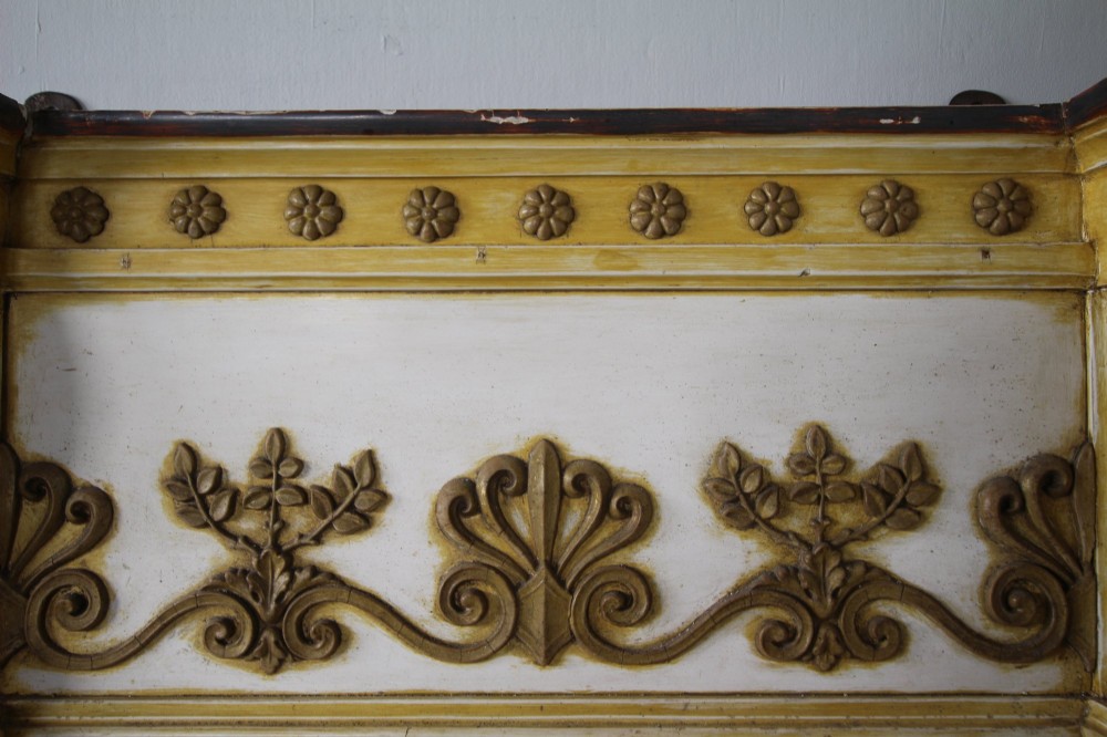 A tall nineteenth-century English Regency pier mirror featuring a cream and gilt frame flanked by fluted Corinthian columns and a decorated frieze. View VI