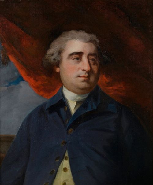 fig 1. An 18th-century oil portrait depicting a gentleman in a blue coat, presented inside a beaded giltwood frame.