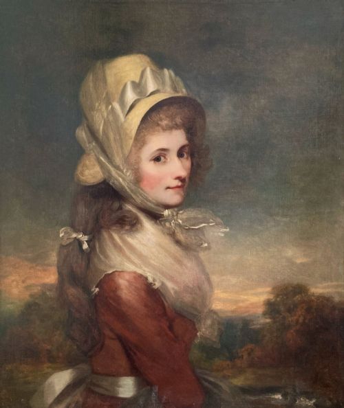 fig 2. An antique Georgian oil painting depicting a young lady wearing a bonnet and red dress inside a gilded beaded frame.