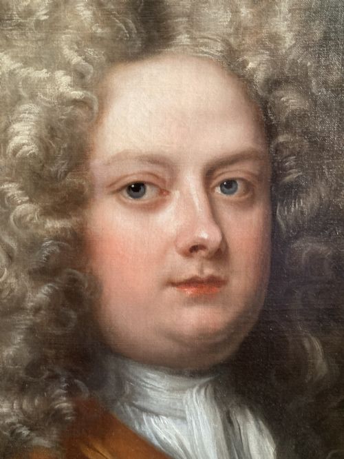fig 3. An 18th-century oil portrait depicting a gentleman with a grey periwig and brown mantle within a feigned oval background.