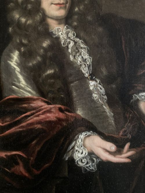 fig 2. A 17th-century oil painting depicting a gentleman wearing a full wig and lace cravat in an ornate carved gold leaf frame.
