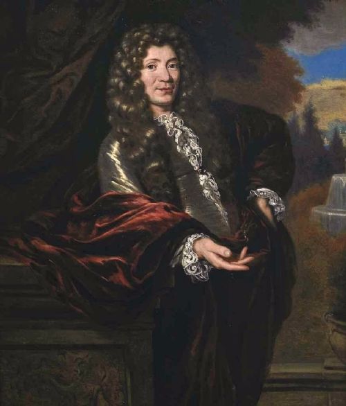fig 4. A 17th-century oil painting depicting a gentleman wearing a full wig and lace cravat in an ornate carved gold leaf frame.