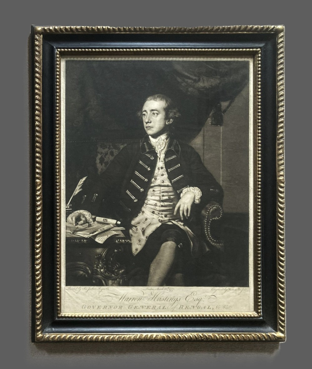 A framed 18th-century monochrome mezzotint portrait depicting Warren Hastings seated at a desk in formal period attire.