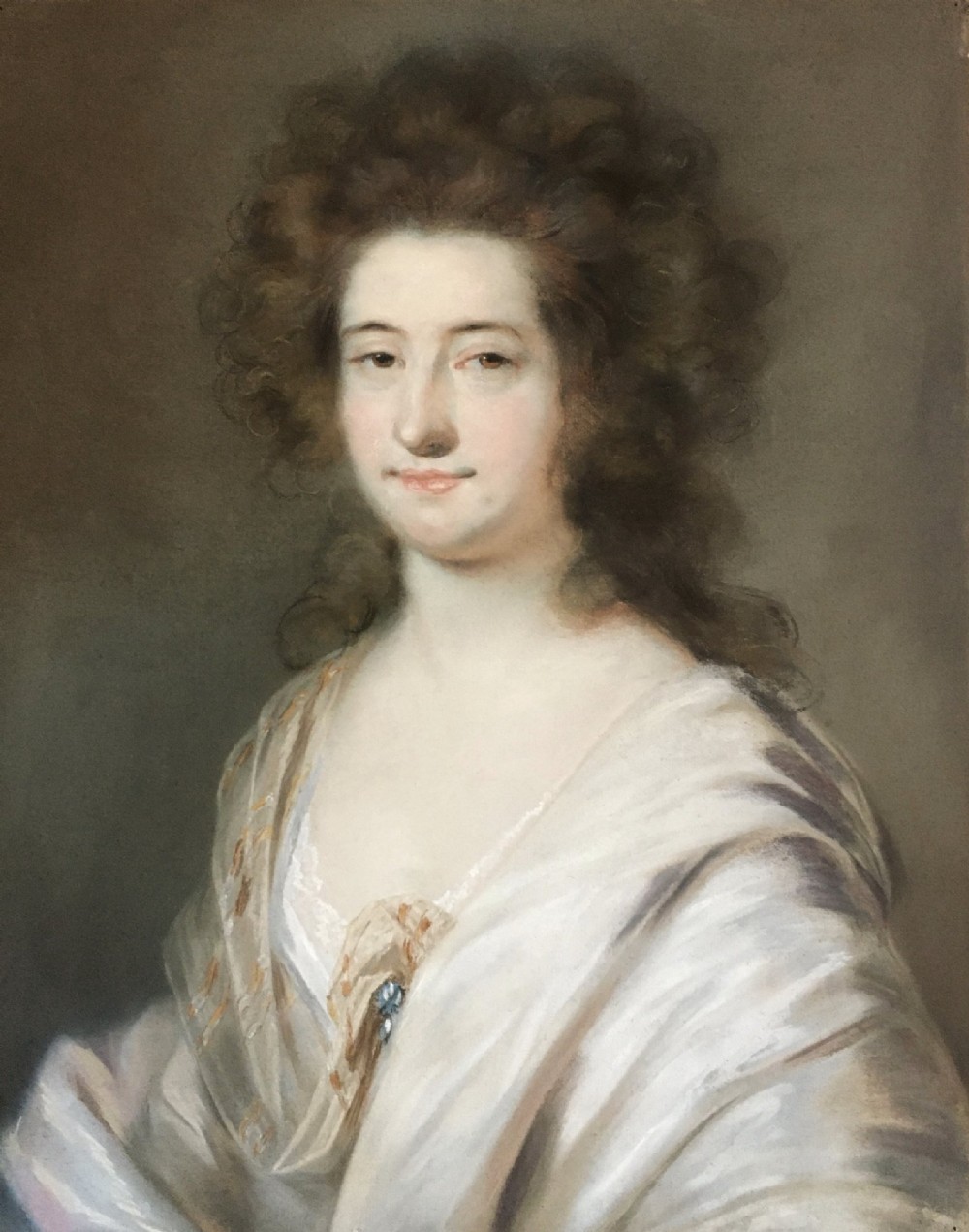 A late 18th-century pastel portrait depicting a woman with voluminous brown hair wearing a draped white shawl and lace detail.