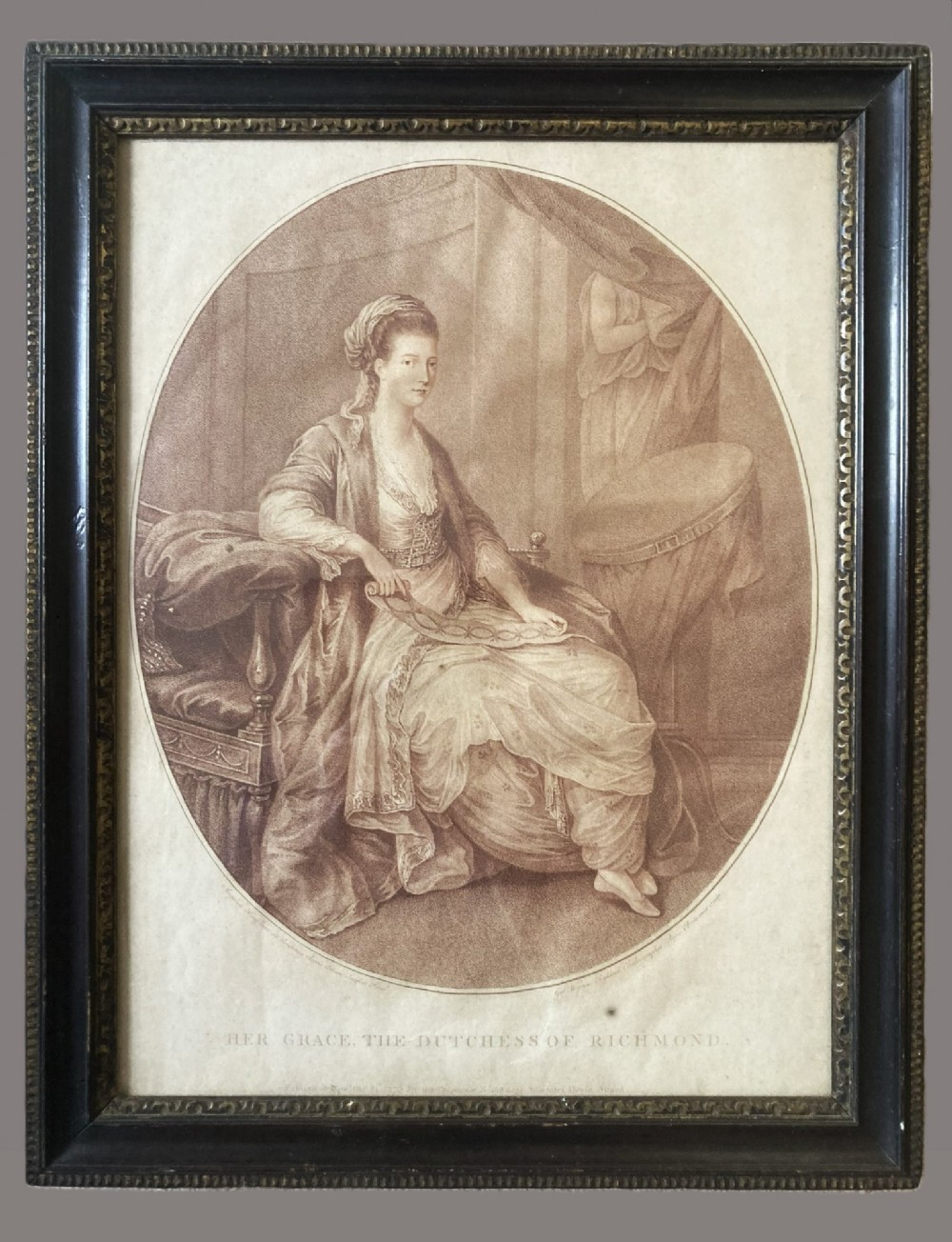 An 18th-century oval sepia engraving depicting a seated noblewoman in classical drapery holding a ribbon. View II