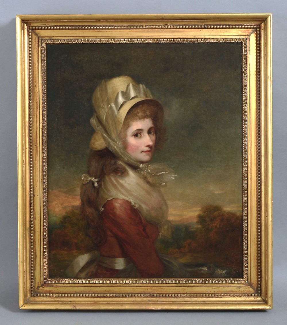 An antique Georgian oil painting depicting a young lady wearing a bonnet and red dress inside a gilded beaded frame.
