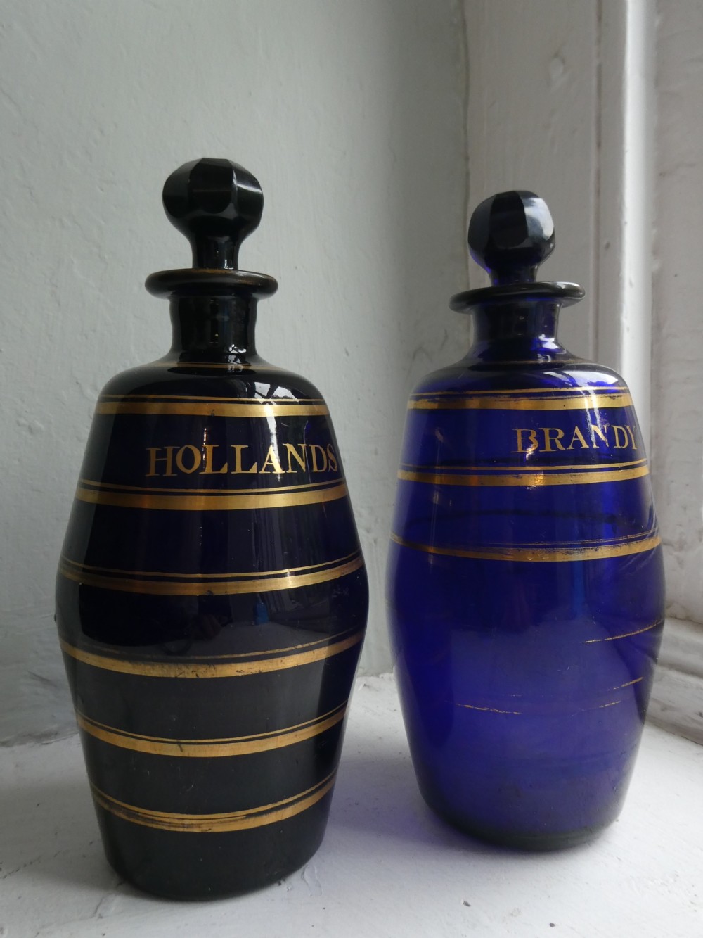 Two Bristol Blue Gin & Brandy Bottles