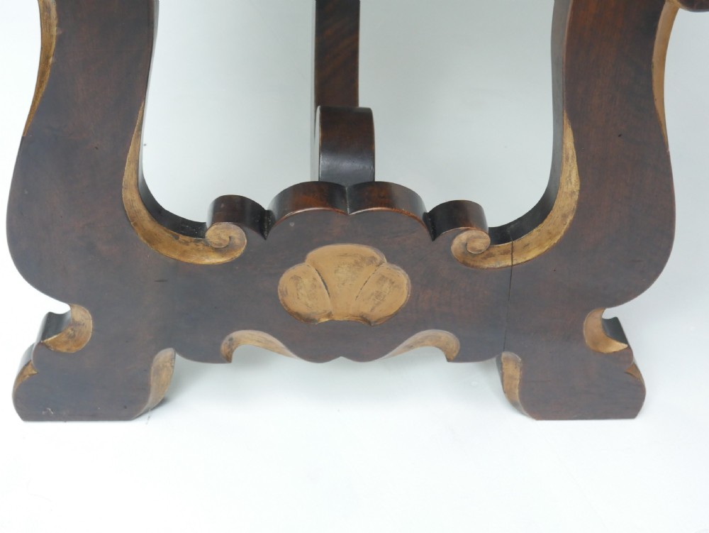 A large antique Scottish mahogany and walnut serving table featuring four brass-handled drawers, carved scroll leg supports, and a low rear gallery back. View XIII