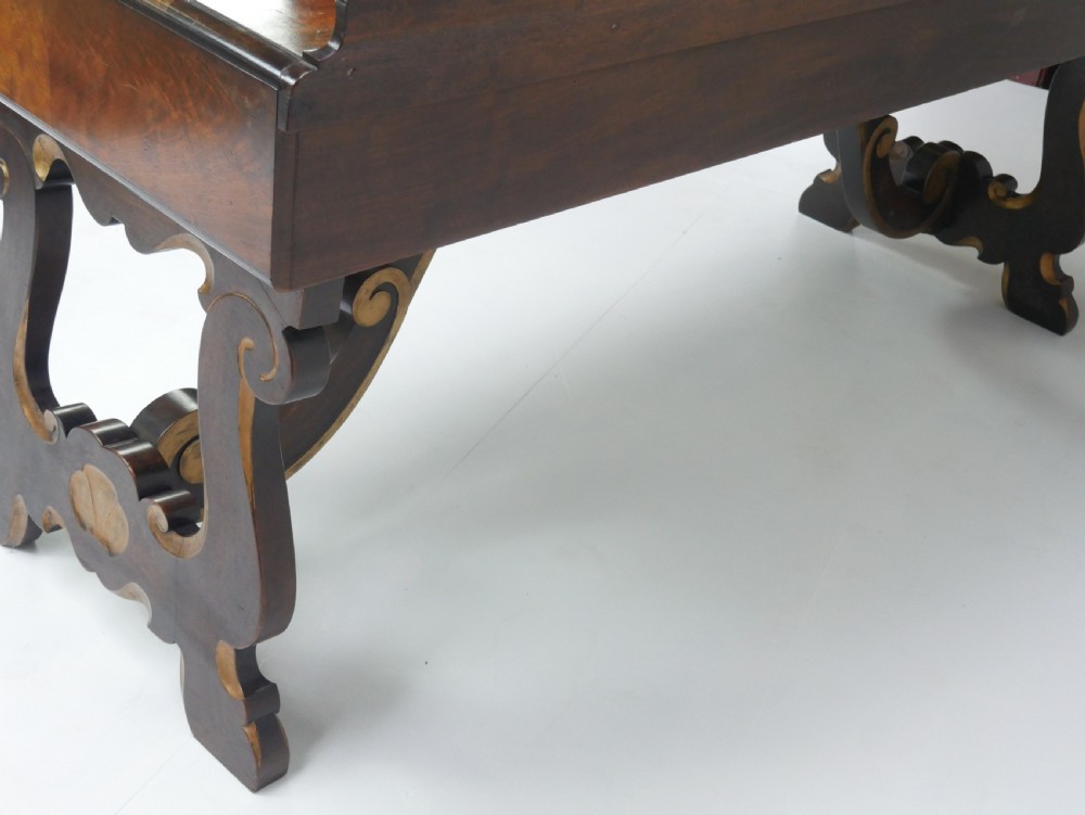 A large antique Scottish mahogany and walnut serving table featuring four brass-handled drawers, carved scroll leg supports, and a low rear gallery back. View XIV