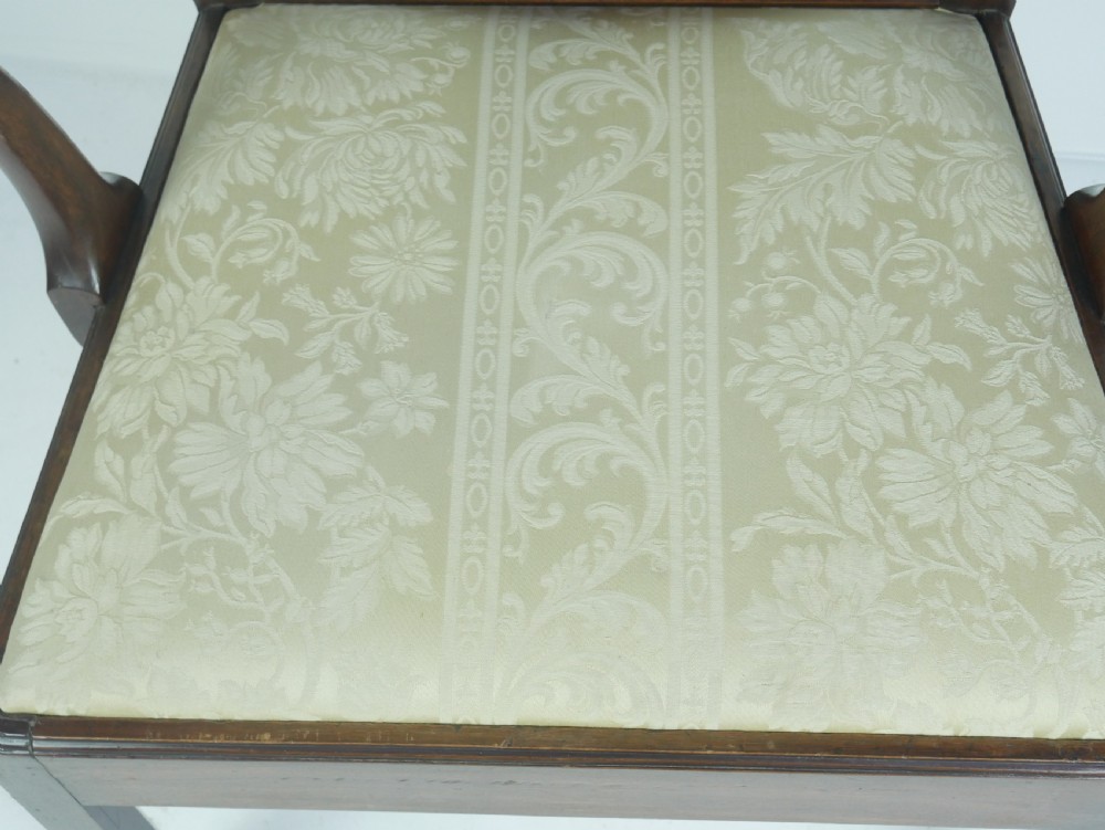 A Georgian mahogany open armchair featuring a vase-shaped splat back, curved armrests, and a cream pattern upholstered seat. View II