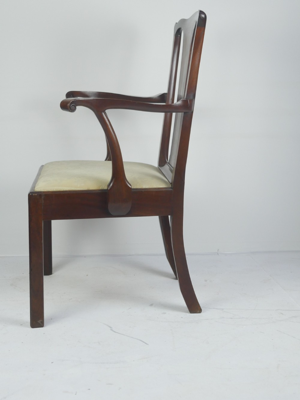 A Georgian mahogany open armchair featuring a vase-shaped splat back, curved armrests, and a cream pattern upholstered seat. View III