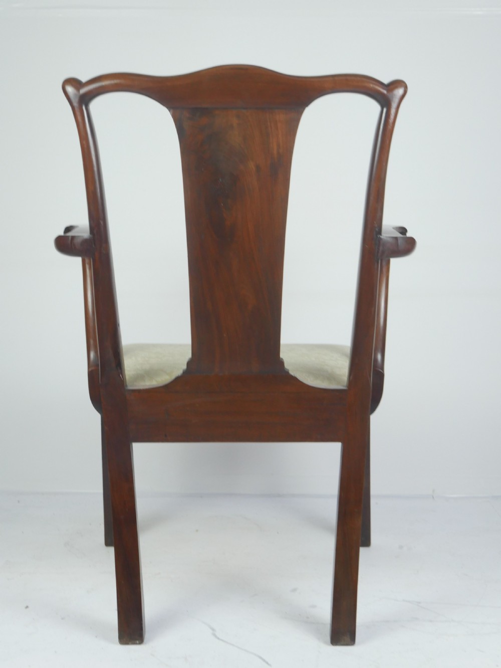 A Georgian mahogany open armchair featuring a vase-shaped splat back, curved armrests, and a cream pattern upholstered seat. View IV