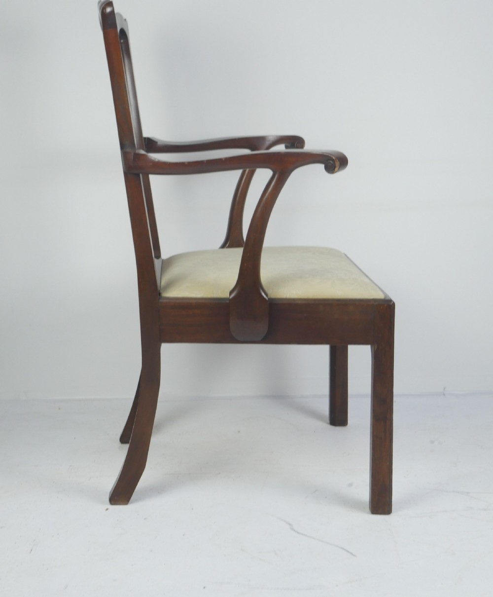 A Georgian mahogany open armchair featuring a vase-shaped splat back, curved armrests, and a cream pattern upholstered seat. View V