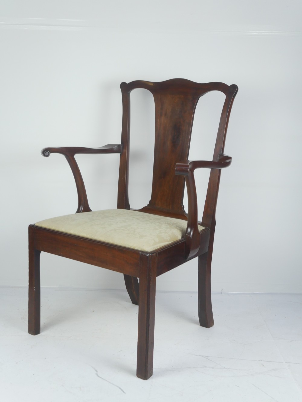 A Georgian mahogany open armchair featuring a vase-shaped splat back, curved armrests, and a cream pattern upholstered seat. View VI