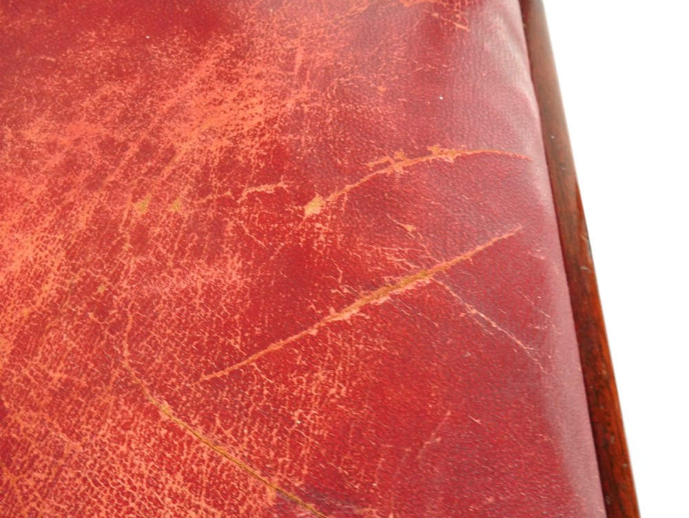 A pair of 19th-century mahogany side chairs with pierced back splats, serpentine top rails, straight legs with stretchers, and red leather seats. View XII