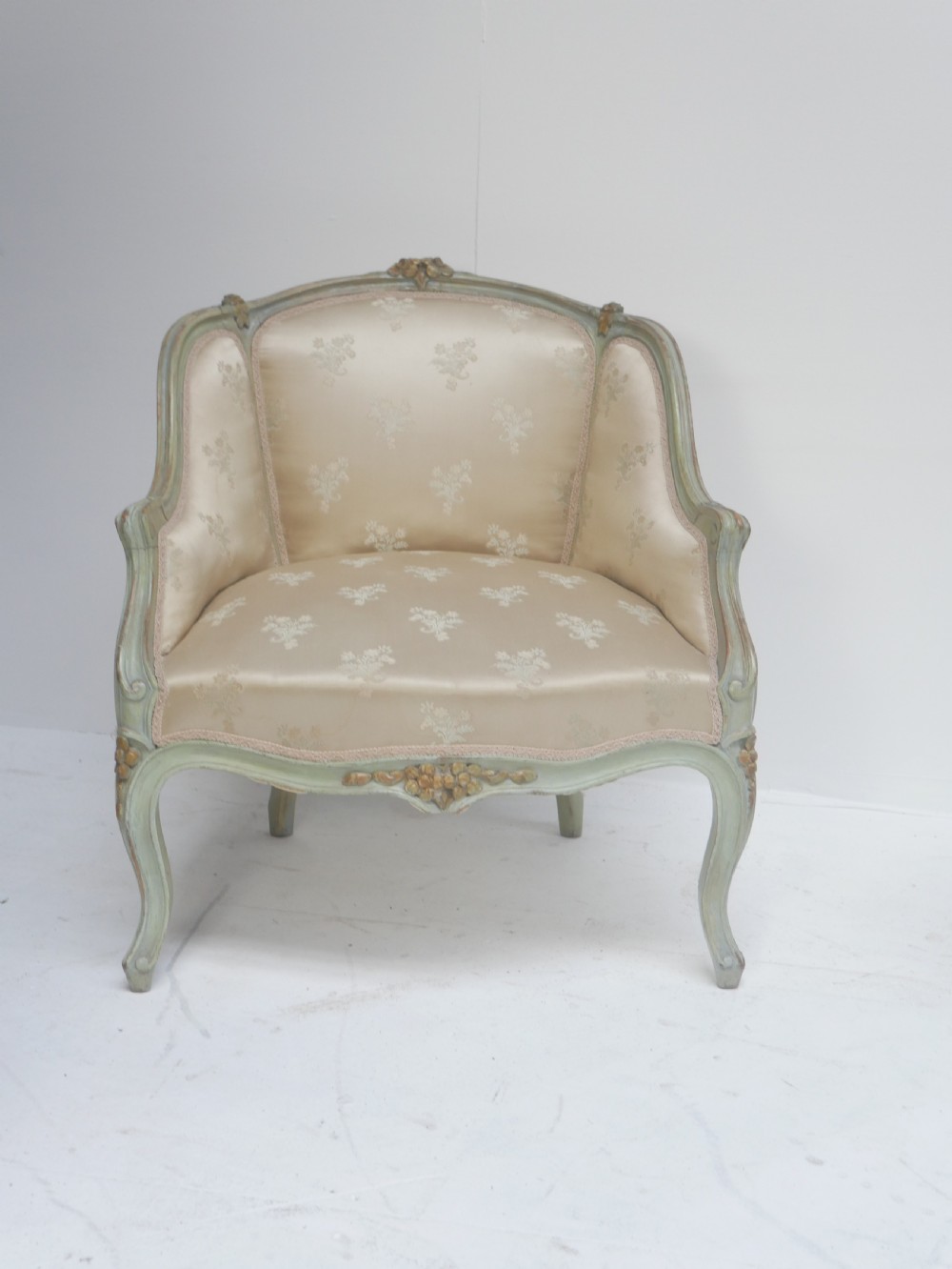 A pair of antique Scandinavian armchairs featuring pale green carved painted frames, cabriole legs, and cream floral pattern damask upholstery. View III