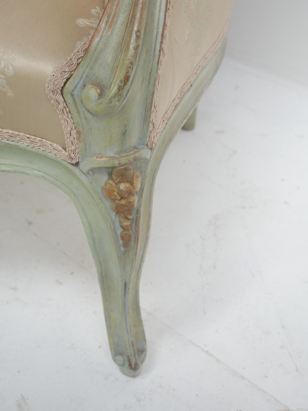 A pair of antique Scandinavian armchairs featuring pale green carved painted frames, cabriole legs, and cream floral pattern damask upholstery. View IV
