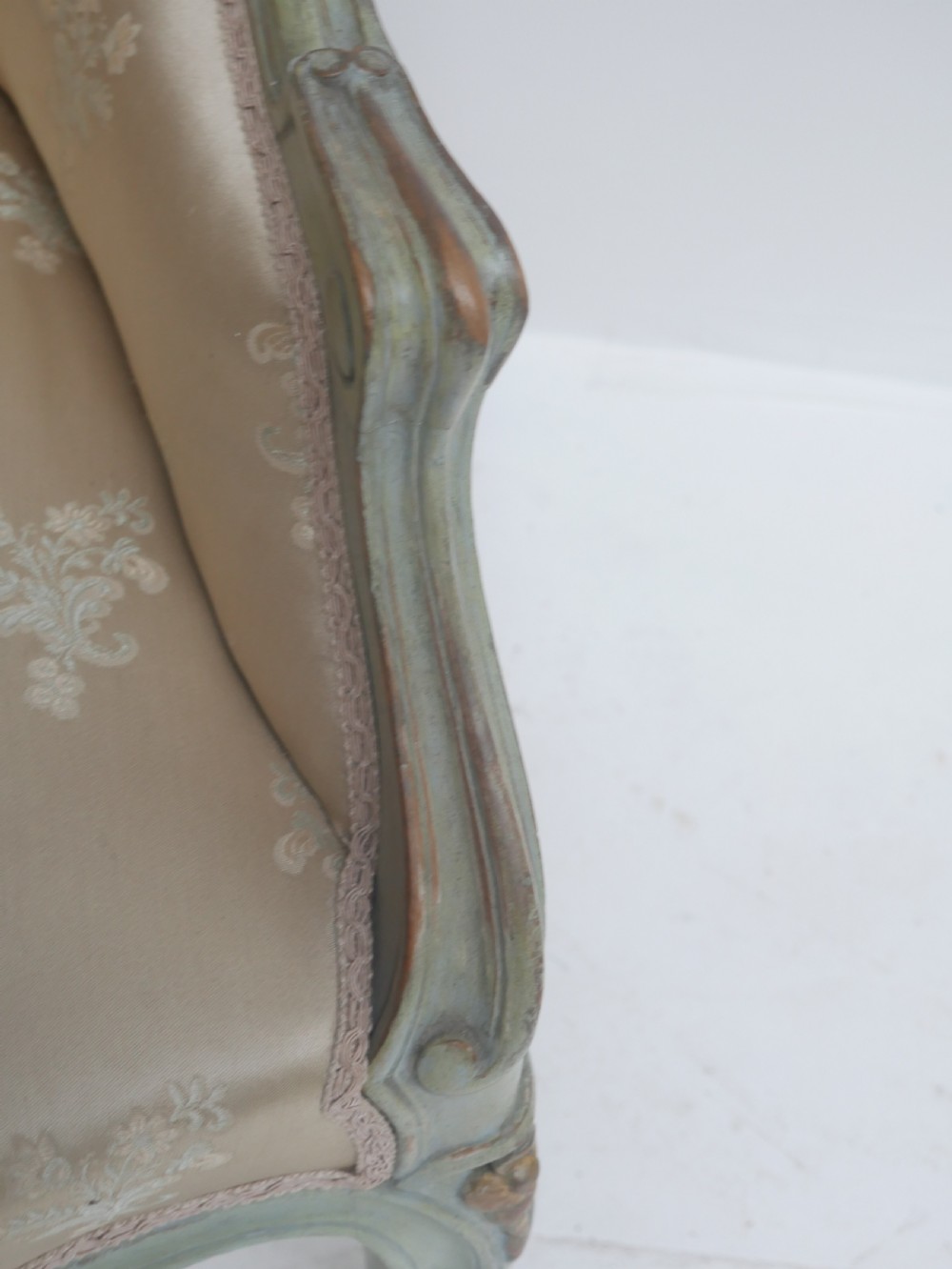 A pair of antique Scandinavian armchairs featuring pale green carved painted frames, cabriole legs, and cream floral pattern damask upholstery. View VI
