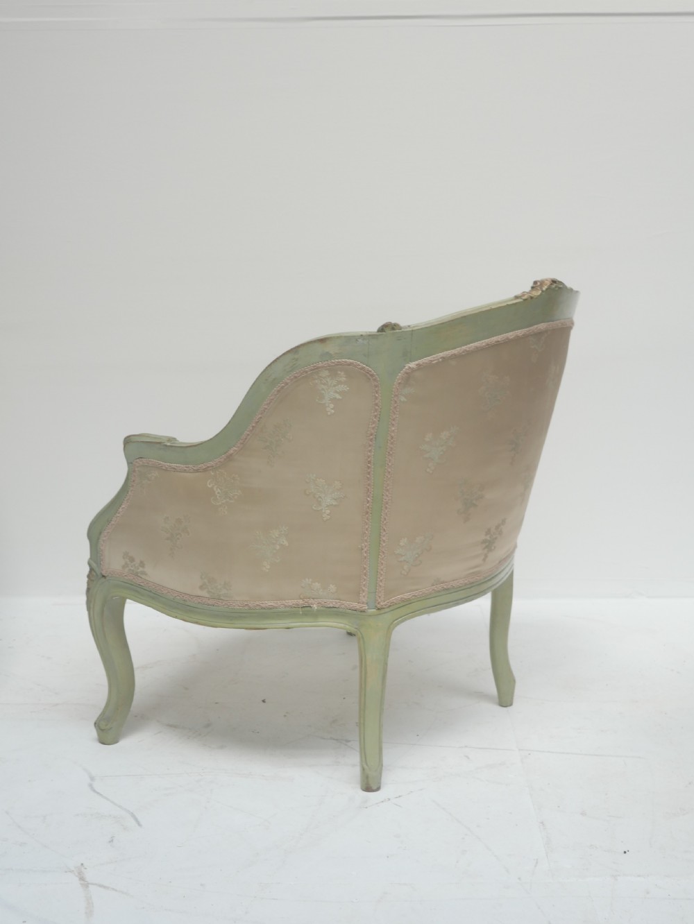A pair of antique Scandinavian armchairs featuring pale green carved painted frames, cabriole legs, and cream floral pattern damask upholstery. View VII