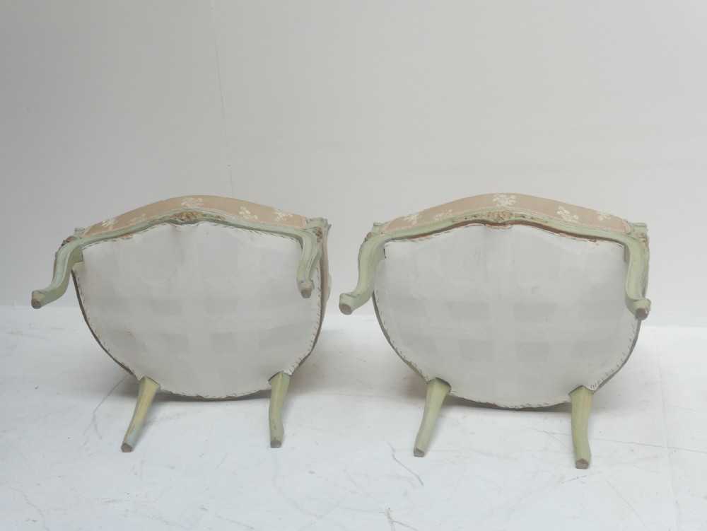 A pair of antique Scandinavian armchairs featuring pale green carved painted frames, cabriole legs, and cream floral pattern damask upholstery. View IX