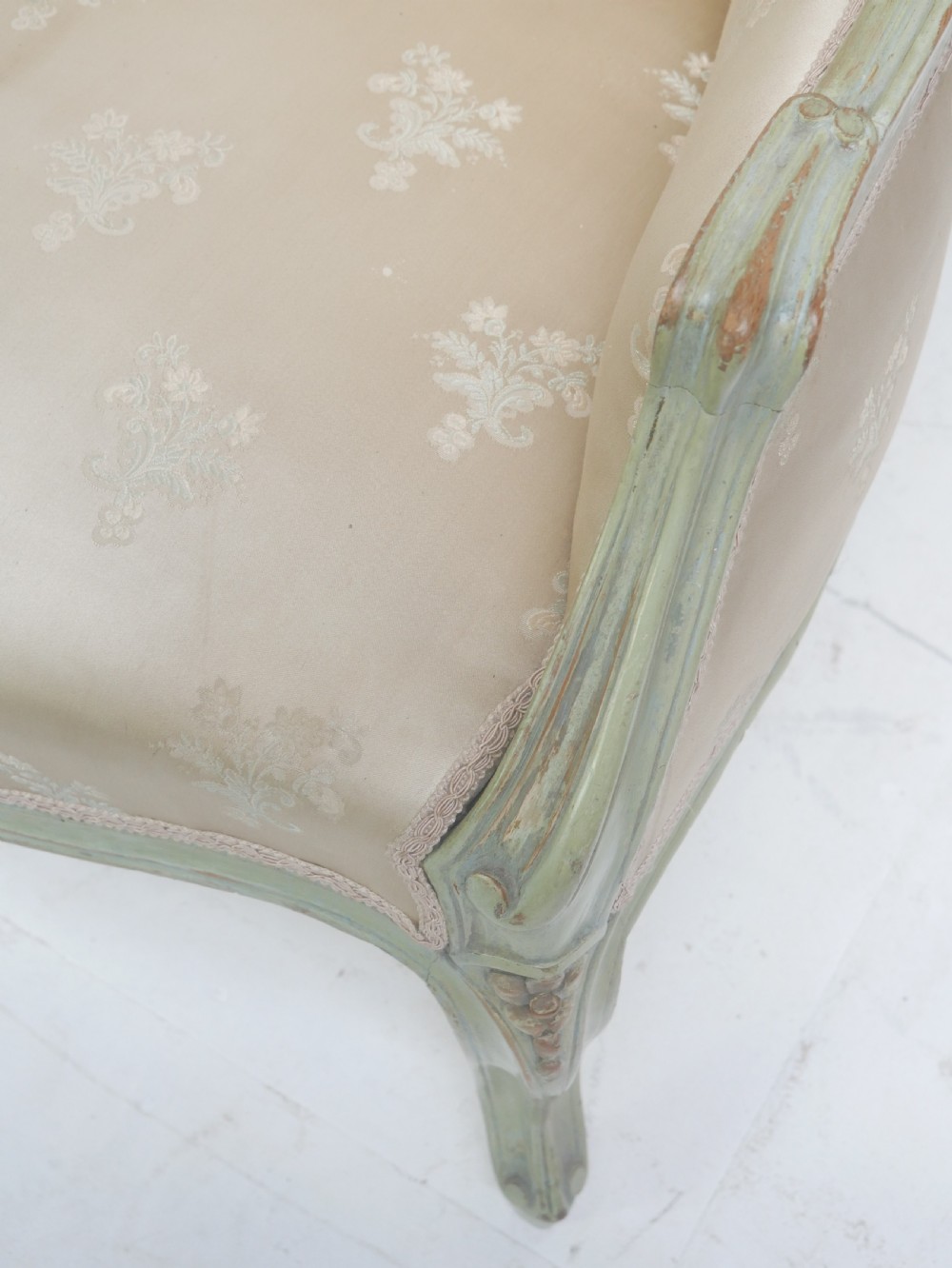 A pair of antique Scandinavian armchairs featuring pale green carved painted frames, cabriole legs, and cream floral pattern damask upholstery. View XI