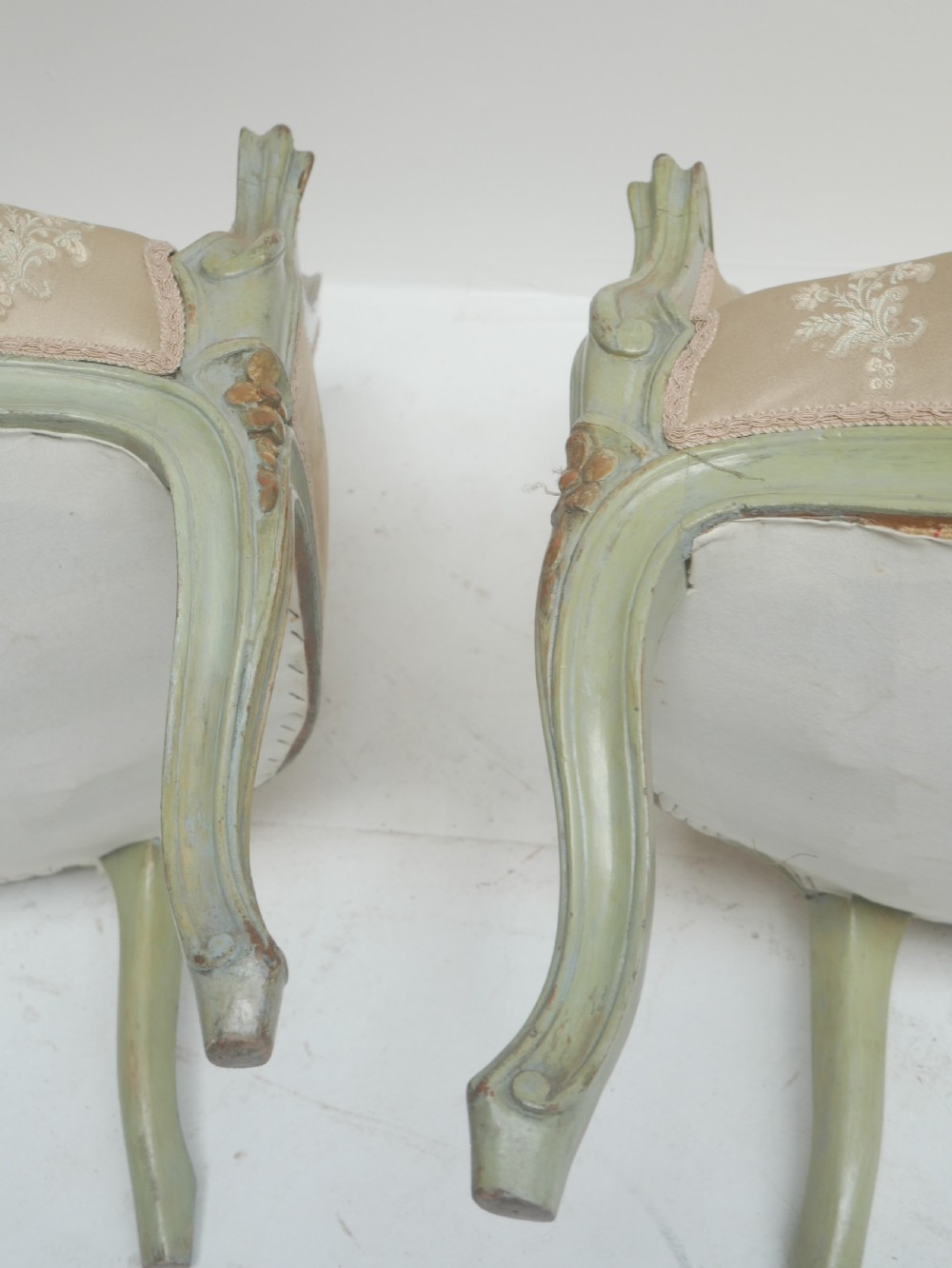 A pair of antique Scandinavian armchairs featuring pale green carved painted frames, cabriole legs, and cream floral pattern damask upholstery. View XII