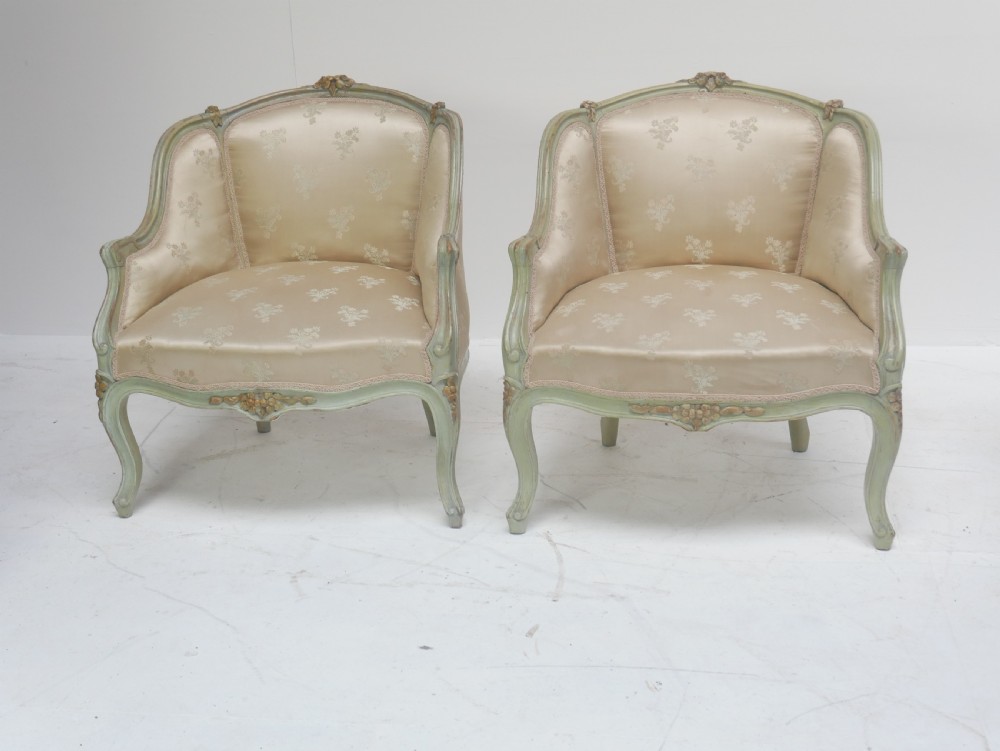 A pair of antique Scandinavian armchairs featuring pale green carved painted frames, cabriole legs, and cream floral pattern damask upholstery. View XIV