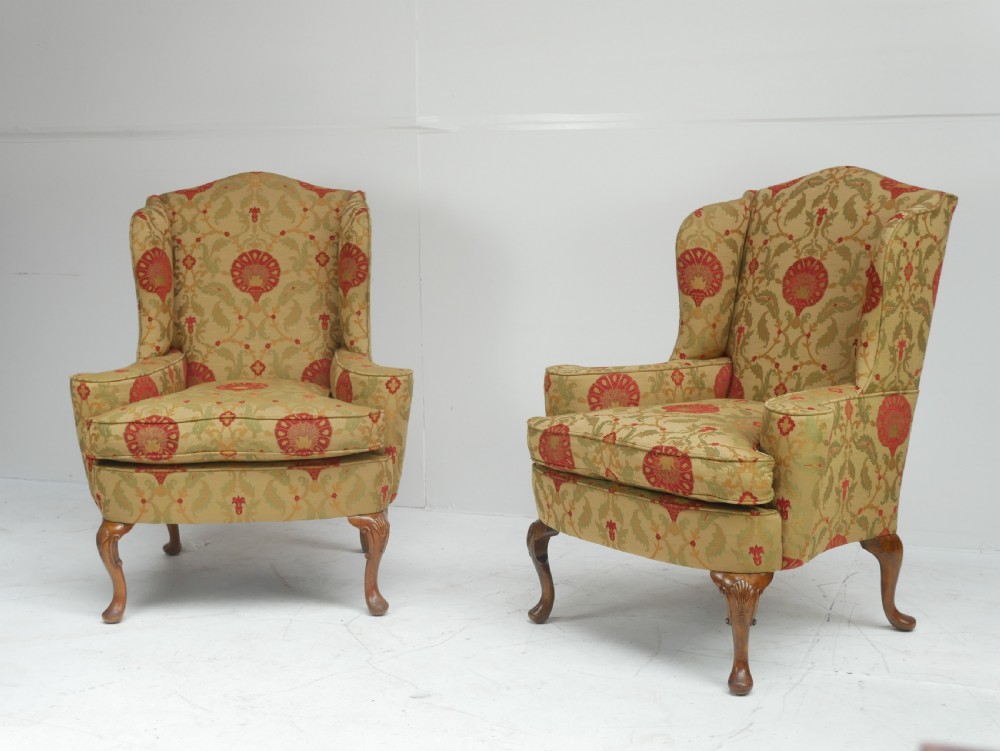 A Pair of 19th century walnut wing armchairs.