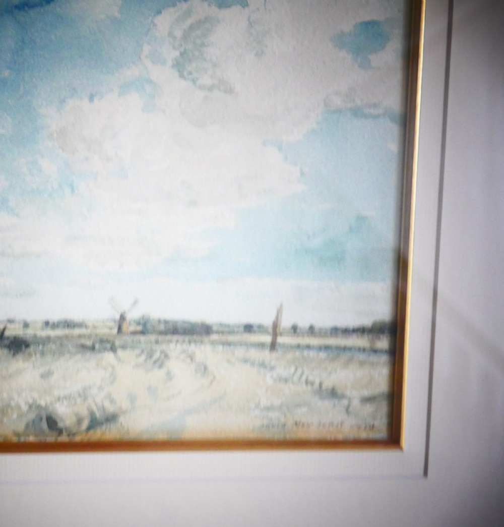A framed watercolour painting by David Muirhead depicting an expansive sky above a low Cambridgeshire horizon within a slim gilt frame. View II
