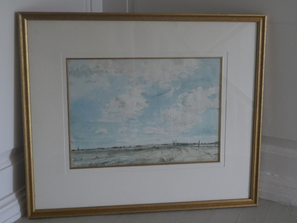 A framed watercolour painting by David Muirhead depicting an expansive sky above a low Cambridgeshire horizon within a slim gilt frame. View V