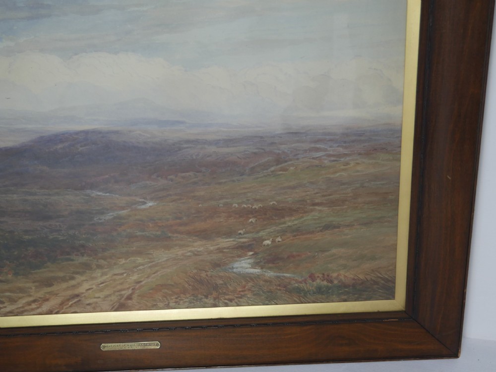 A framed Victorian watercolour landscape painting by Arthur H. Enock showing the Isle of Man moorland under a cloudy sky. View II