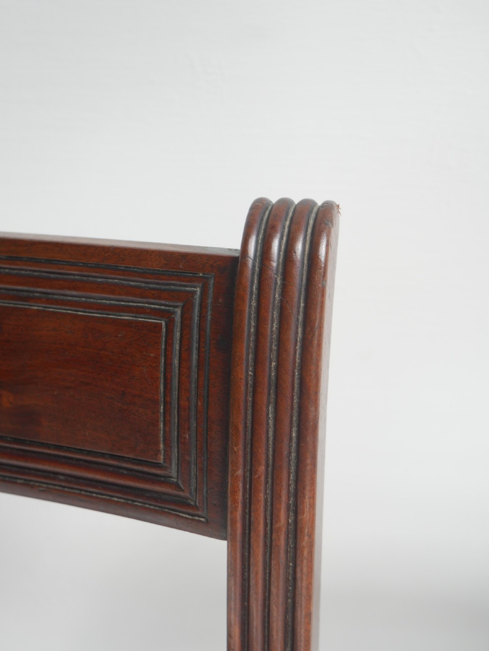 Set of four dark mahogany Regency dining chairs with reeded frames and red and cream striped fabric seats. View XI