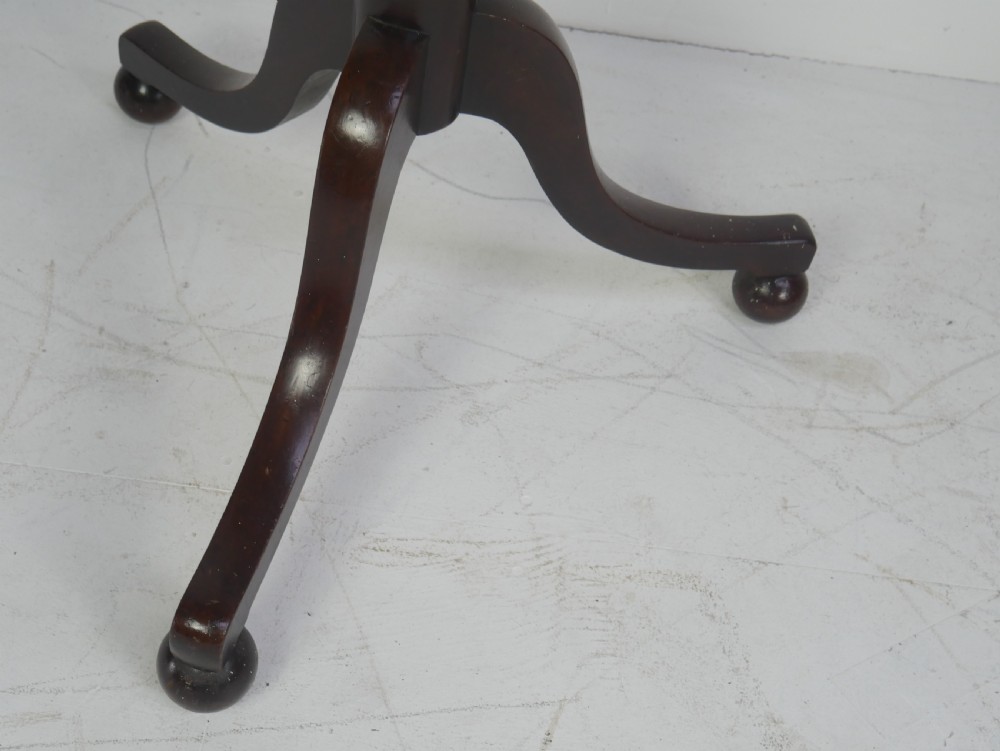 A tall 19th-century turned dark mahogany hat and coat stand with tiered curved branches and a tripod base. View II