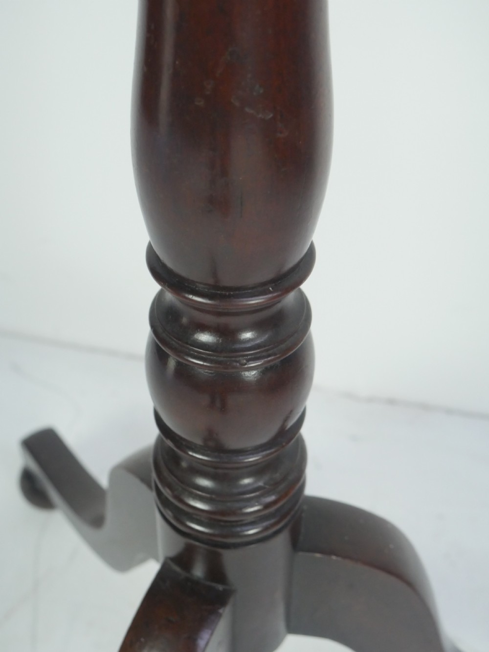 A tall 19th-century turned dark mahogany hat and coat stand with tiered curved branches and a tripod base. View III