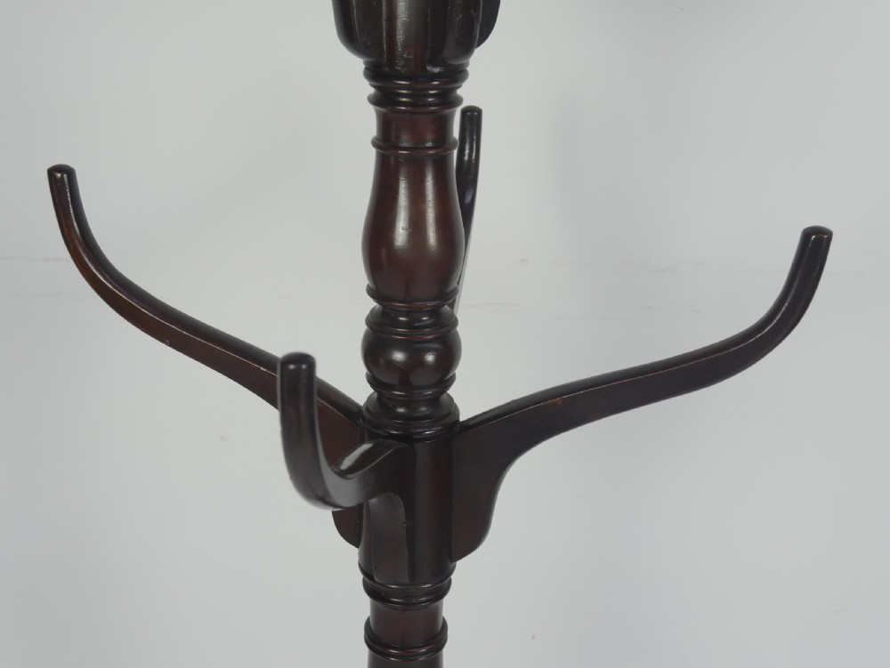 A tall 19th-century turned dark mahogany hat and coat stand with tiered curved branches and a tripod base. View IV