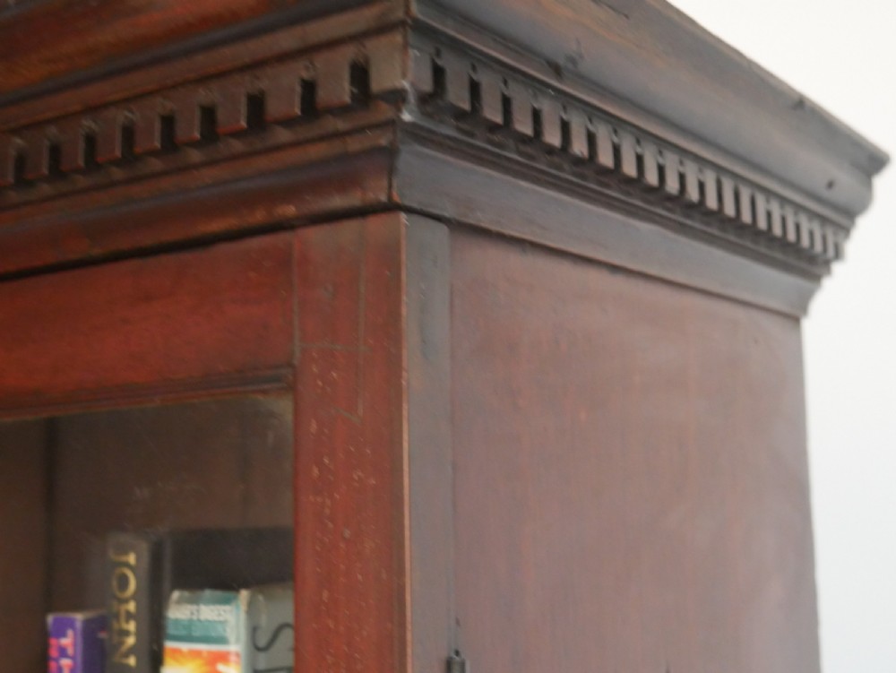 A Georgian mahogany bureau bookcase featuring a two-door glazed upper cabinet, a slant-front writing bureau, and three long drawers with brass handles. View VI