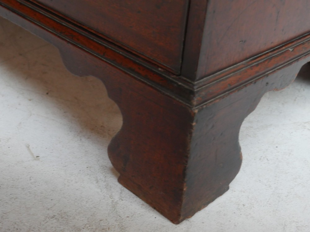 A Georgian mahogany bureau bookcase featuring a two-door glazed upper cabinet, a slant-front writing bureau, and three long drawers with brass handles. View VII
