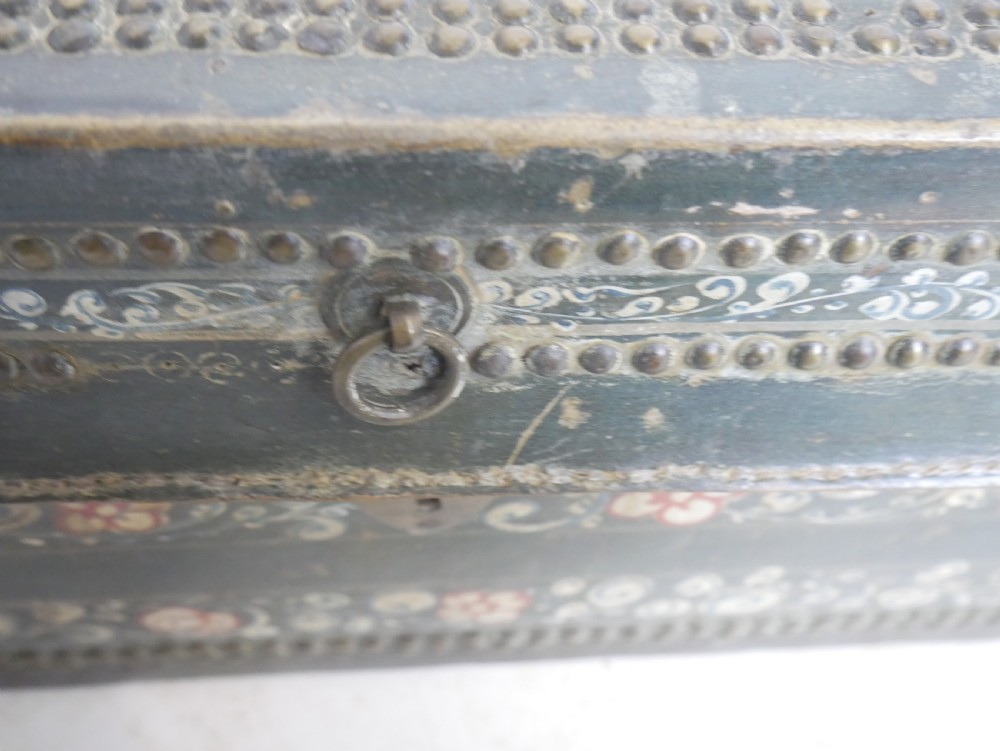A dark green rectangular leather trunk decorated with hand-painted floral borders and studded brass tacks around the edges. View VIII