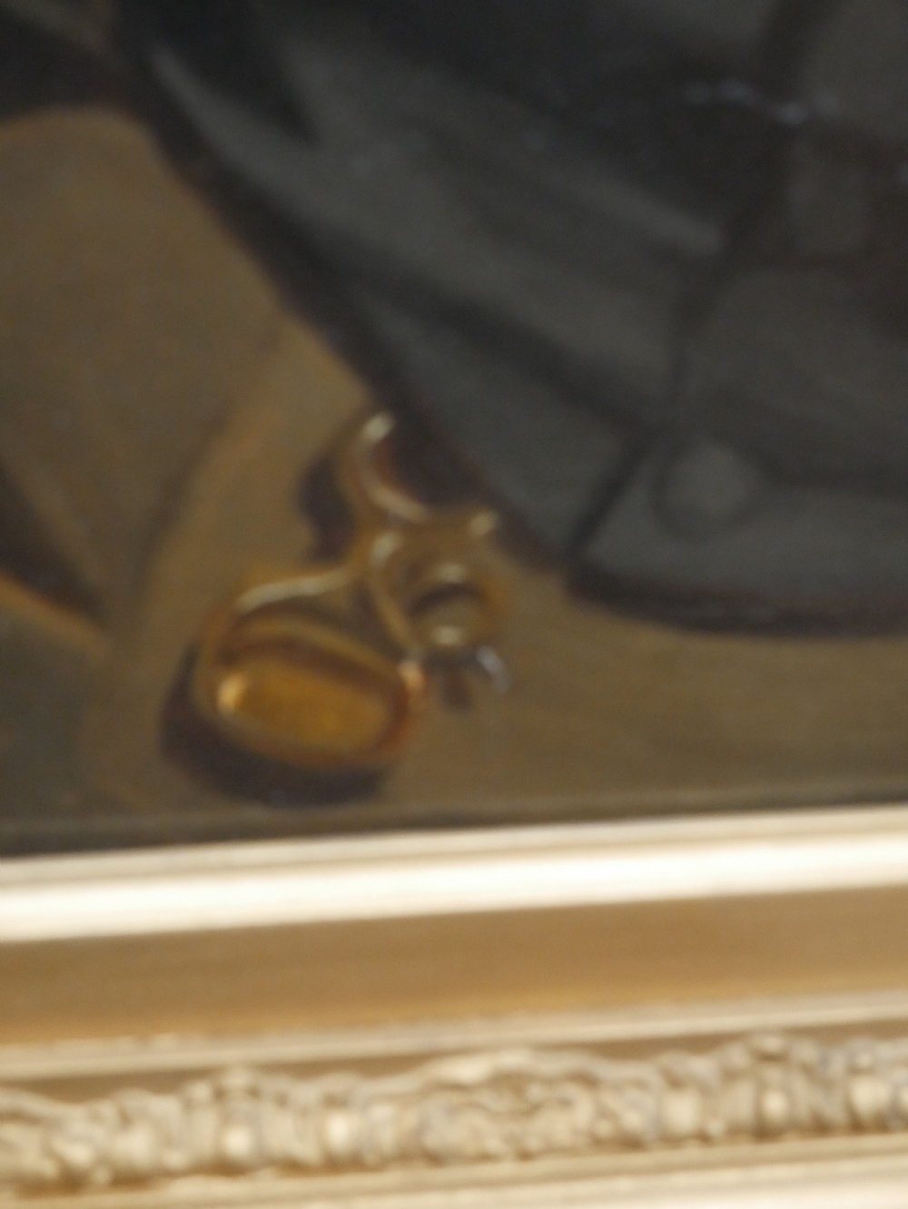 A 19th-century oil painting depicting a gentleman in formal dark attire, framed within an elaborate gold gilt frame. View IV