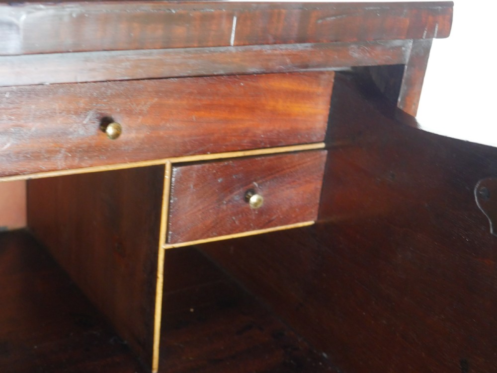 A 19th-century dark mahogany secretaire bookcase featuring an upper glazed two-door cabinet over a drop-front fitted writing desk and three lower drawers. View V