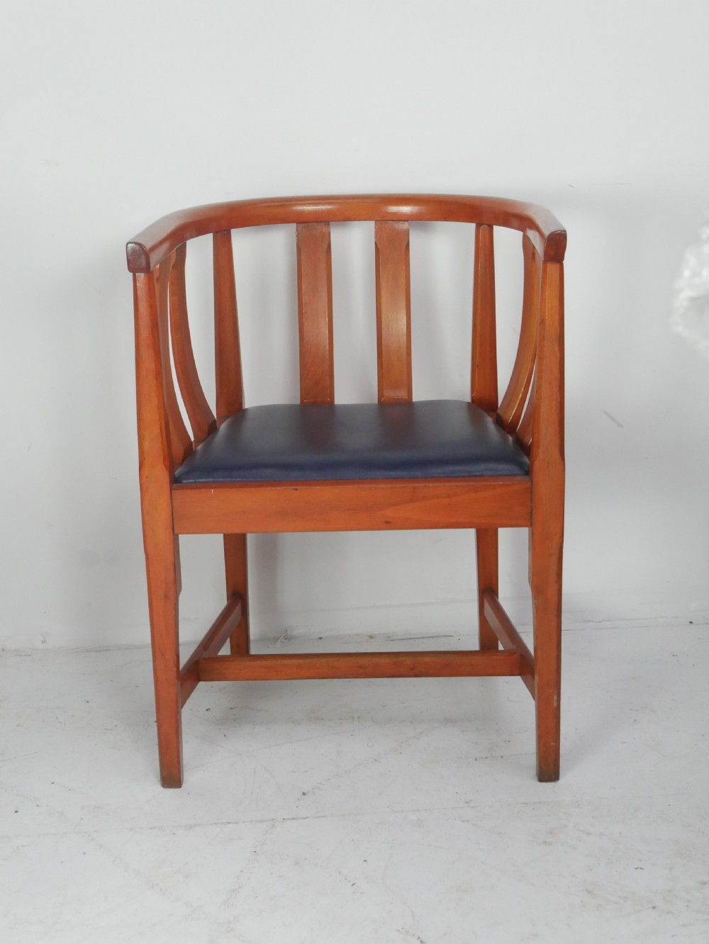 A pair of warm wood Arts and Crafts tub chairs with curved slat backs and blue upholstered seats. View II
