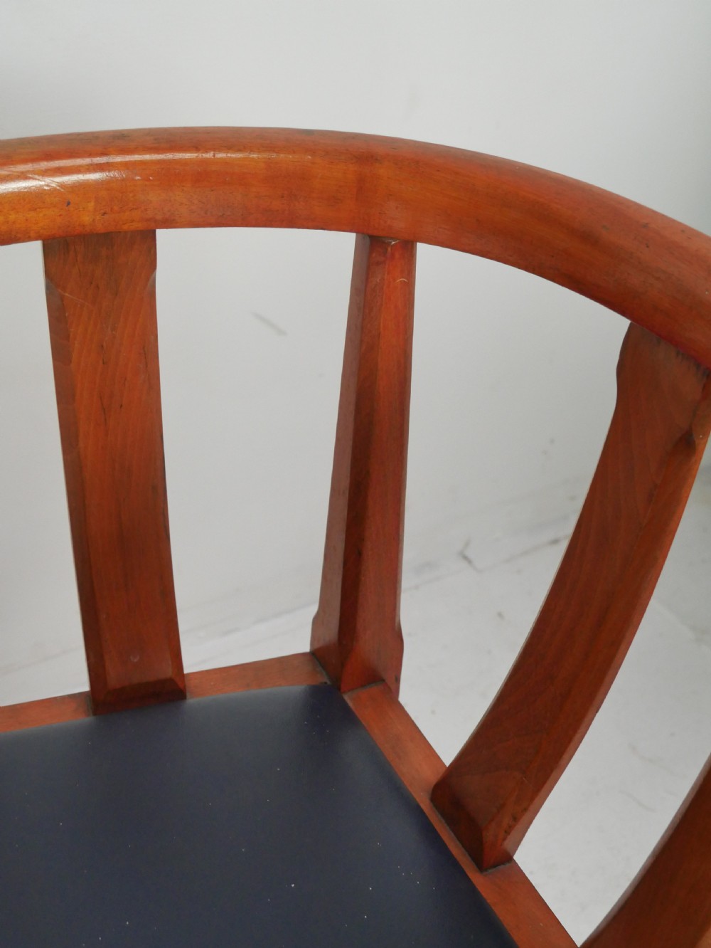 A pair of warm wood Arts and Crafts tub chairs with curved slat backs and blue upholstered seats. View VIII