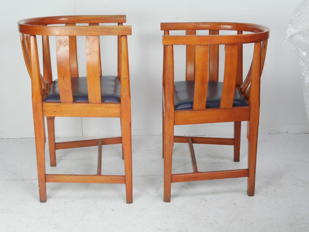 A pair of warm wood Arts and Crafts tub chairs with curved slat backs and blue upholstered seats. View XI